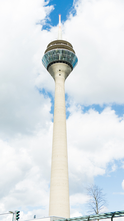 tv tower in dusseldorf on clowdy sky background. germanyのeditorial素材