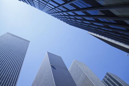 Modern mirror buildings seen from a personal perspective.