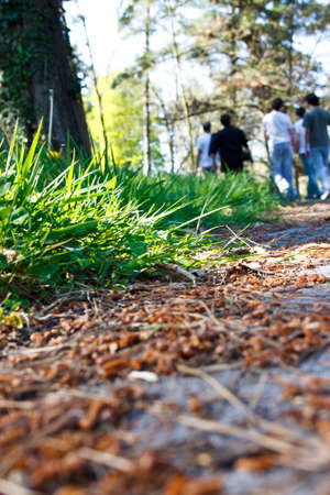 A group of friends leaving a park after a day off.