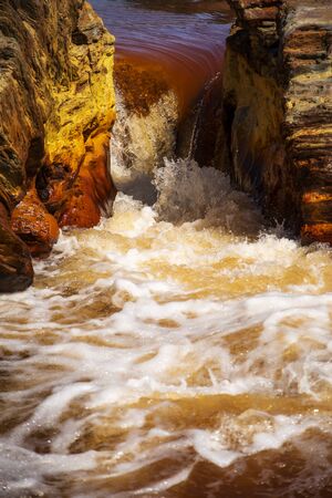 Beautiful landscape in Huelva, Rio Tinto, small cascade with water flowingの写真素材