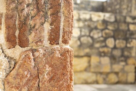 Fragment of wall with wall with stones at background.の写真素材