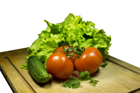 Fresh vegetables on a wooden table with isolated backgroundの写真素材