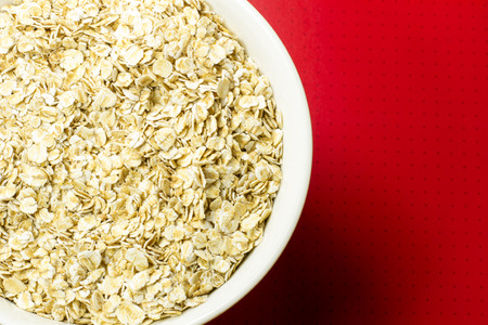 oatmeal in a bowl on red background