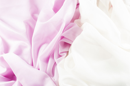 crumpled delicate pink silk as backgroundの写真素材