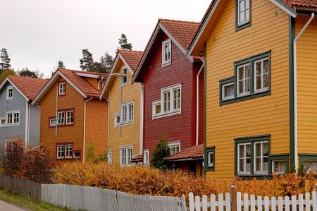 A row of residential houses, painted in various coloursの写真素材