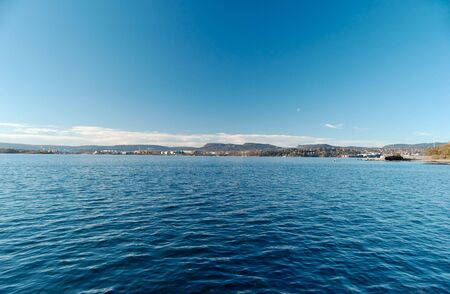 Fish-eye view over Oslo Fjord, looking at Bygøy and Fornebu. Sky and water are filter-polarised.  の写真素材