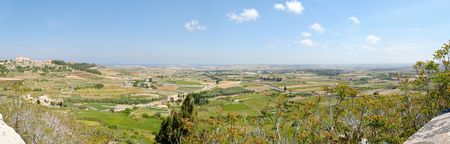 150 degree panorama of Maltese countryside with foreground vegetation. Stitched from 7 individual images shot at 18mm. The image is taken from Mdina.  の写真素材