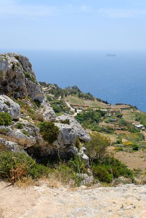 Dingli cliffs at the southern end of Malta, with a view towards Maltese Southernmost territory - Filfla island.  の写真素材