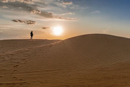 sand dunes of the Sahara desert lit by the light of the setting sun of the sun,