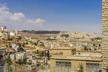 view of the city of Bethlehem from the hill, urban buildings, against the sky and clouds, Palestinian Authority, Israelの写真素材