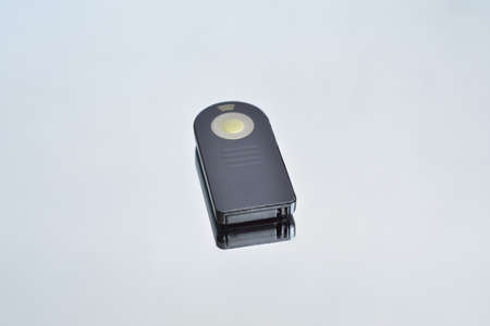 remote shutter release control for the camera, and its reflection on the mirror surface, on an...