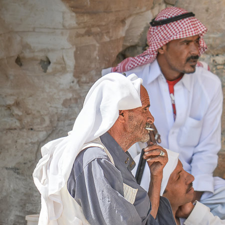 Egypt, South Sinai, Color Canyon Area, June 26, 2013, Bedouins accompanying tourists on routes, rest in the shade of a mountain, at the entrance to the cave.のeditorial素材
