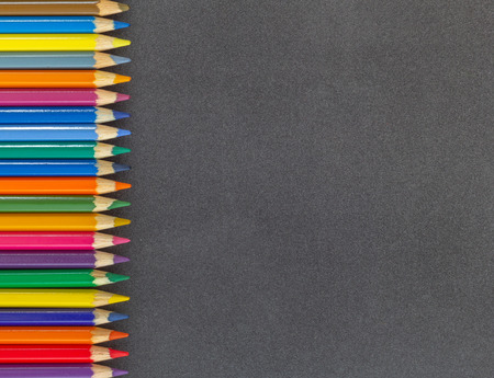 Line background colored pencils left side dark background top viewの写真素材