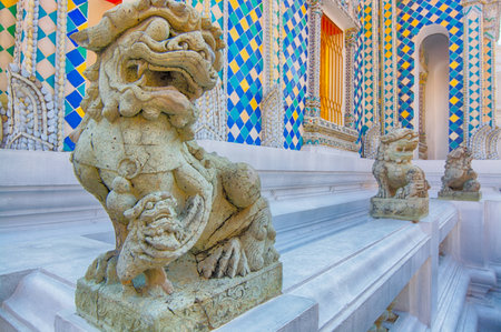 Lion guardian sculptures on fences in Wat Phra Kaew, Bangkok Thailand.の写真素材