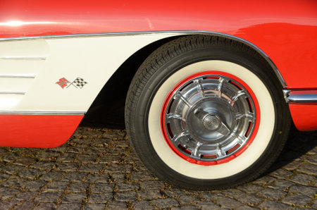 Southern Denmark - August 24, 2017: Side view of front wheel of red and white Chevrolet Corvette.のeditorial素材