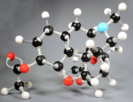 Molecule model of heroin (C12H22O11). Red is oxygen, black is carbon, blue is nirogen and white is hydrogen.の写真素材