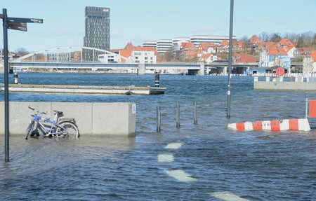 Sonderborg, Denmark - March 29, 2020: Flooded urban harbor area during an extraordinary high tide.のeditorial素材