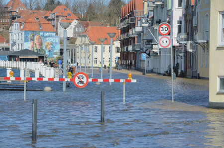 Sonderborg, Denmark - March 29, 2020: Flooded urban harbor area during an extraordinary high tide.のeditorial素材