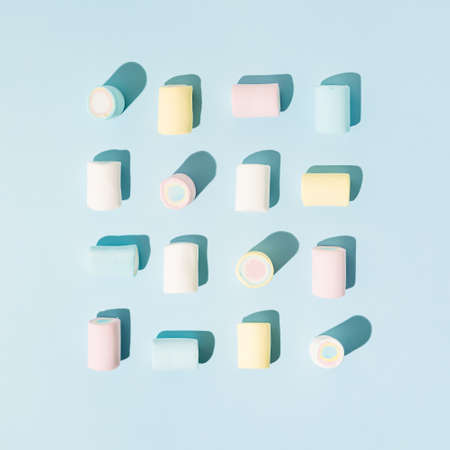 colorful marshmellow pattern on bright blue background. minimal crearive composition.の写真素材