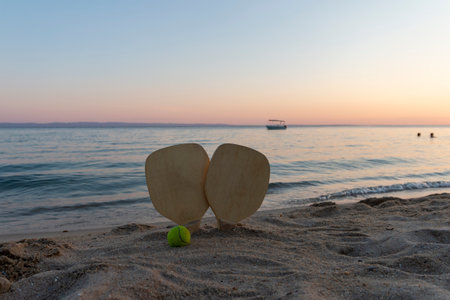 Beach tennis, beach paddle ball. Beach rackets and ball on the beachの写真素材