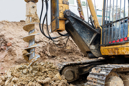 Hydraulic bore pile rig machine at the construction site.Drilling in the ground.Pile foundations.の写真素材