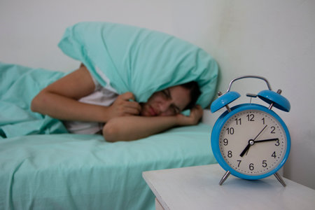 Teen girl hates waking up early in the morning.Beautiful girl feeling bad, she has  menstrual pain and  suffering from headache, emotions and stressの写真素材