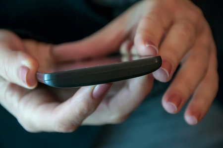 Close up of female hands using a smart phone