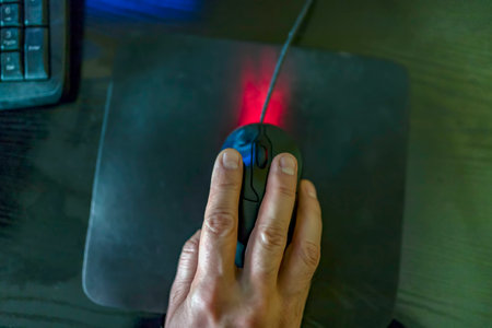 Close Up Hands Multitasking Man Using Mouse Connecting Internet, Internet Of Things Concept, Layout Of Working Place With Wooden Table, Comfortable Working Spaceの写真素材