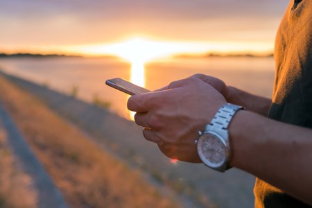 A man sending a text messageの写真素材