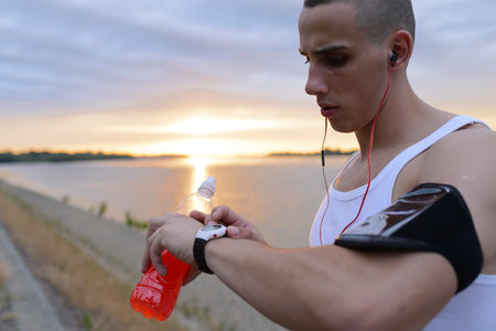 Athlete checking his smart watchの写真素材