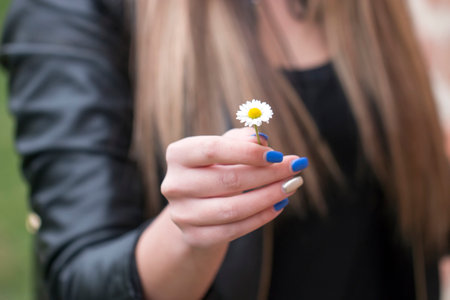 Girl holds dandelionの写真素材