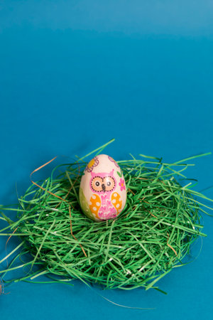 Easter egg on blue background. Religious symbol