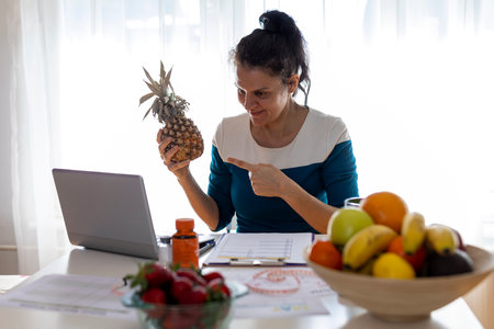 Female nutritionist holding an online consultation with a patient.の写真素材