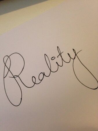 Reality written on white 