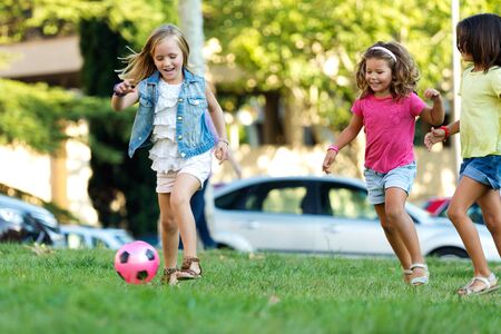 Portrait of group of childrens having fun in the park.