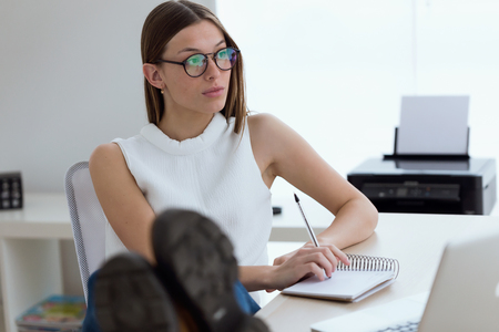 Portrait of business young woman working in the office.の写真素材