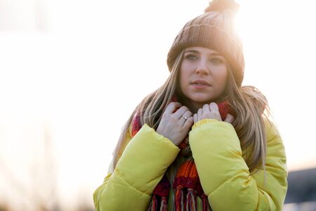 Portrait of beautiful young woman looking sideways in the park.の写真素材