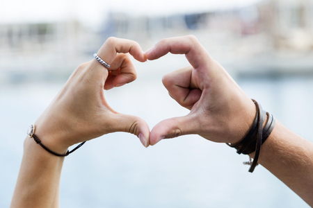 Portrait of happy young couple in love in the city.の写真素材