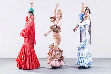 Portrait of pretty three young flamenco dancer in beautiful dress.の写真素材
