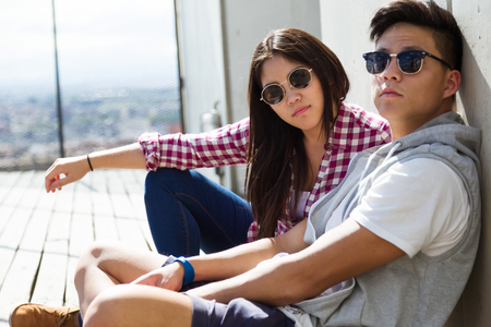 Portrait of happy young couple looking at the views in the city.の写真素材