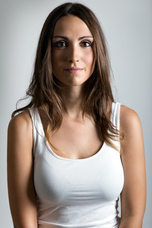 Portrait of young happy woman looking at cameraの写真素材