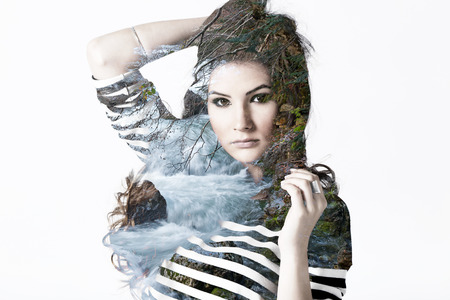 Double exposure portrait of beautiful Caucasian woman