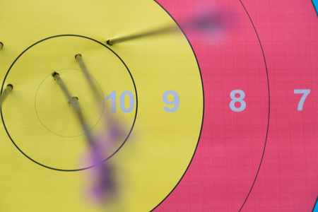 Close-up of archery target with arrows on it.の写真素材