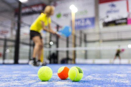 Close-up of paddle tennis balls on blue turf in court.の写真素材