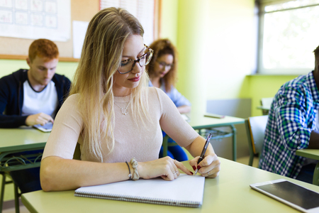 Portrait of group of friends studying in a university classroom.の写真素材