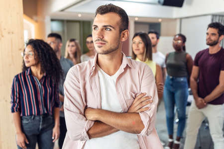 Shot of successful business team posing for presentation of work while looking fowards in a coworking space.の写真素材