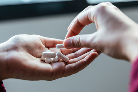 Close up young woman with depression and anxiety taking pills at home