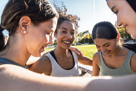Shot of group of sporty friends celebrating after going for a run around the cityの写真素材