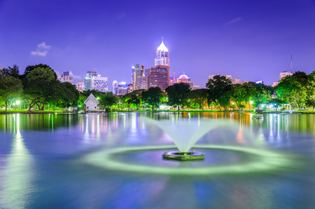 Lumphini Park at dusk near the skyscraper business districtの写真素材