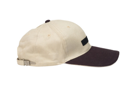 brown two tone baseball caps isolated on white backgroundの写真素材